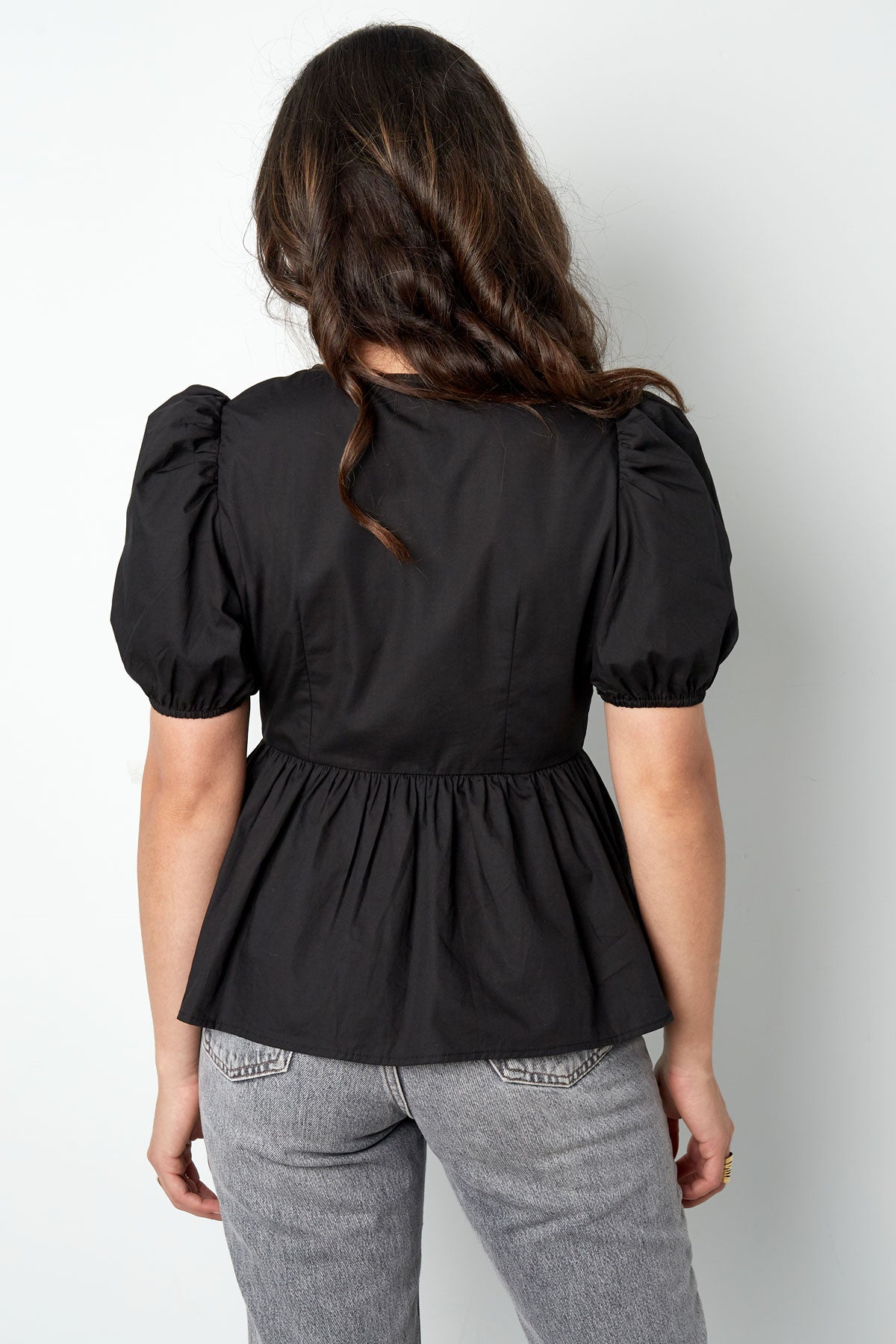 Musthave peplum blouse met strikjes