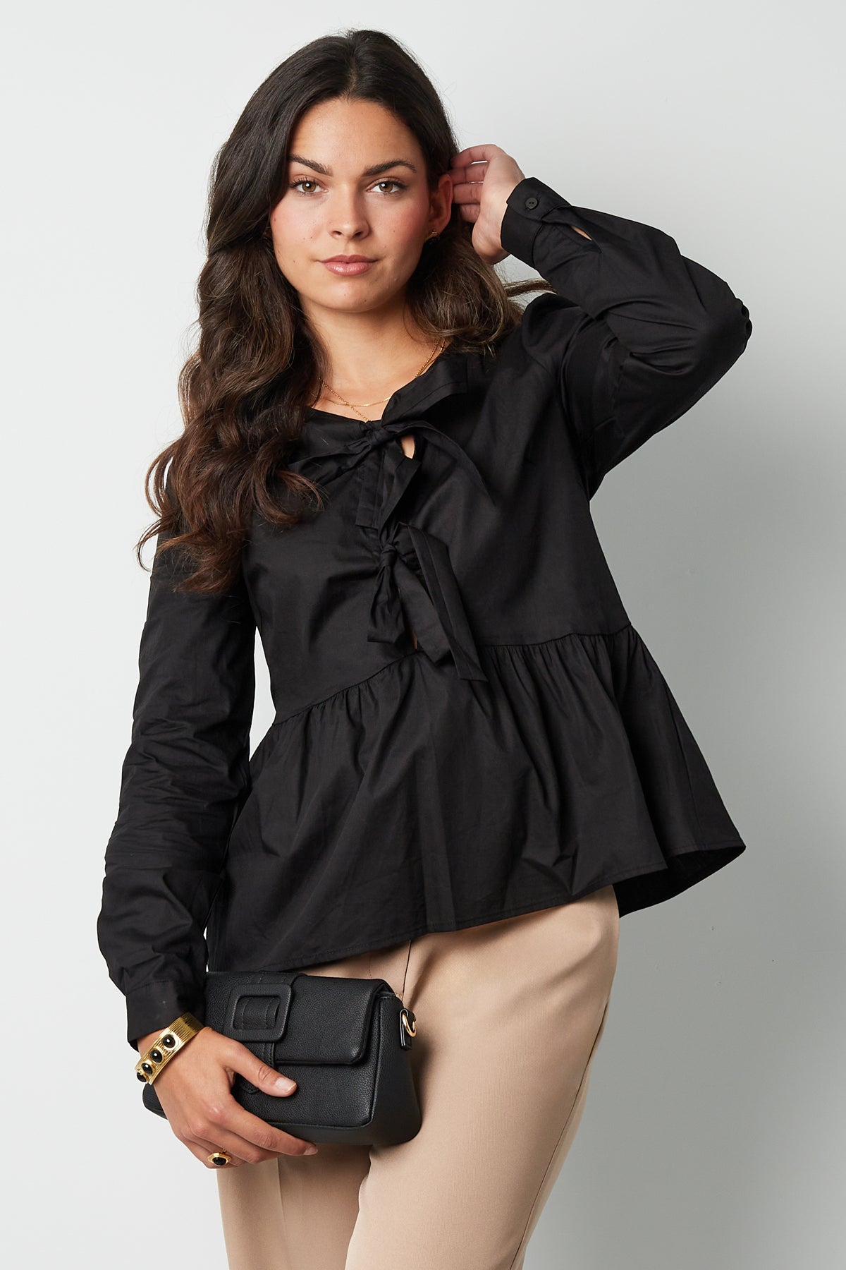 Longsleeve peplum top met strikjes