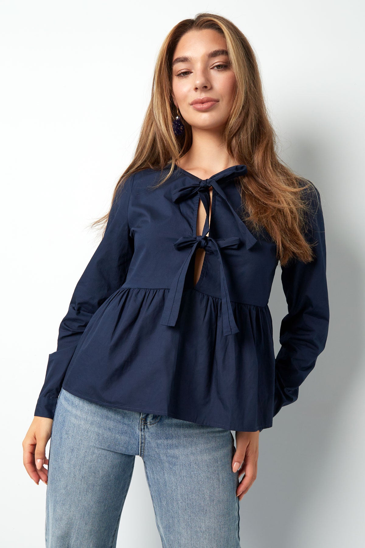 Longsleeve peplum top met strikjes